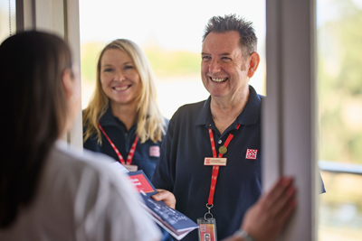Two CFA members speak to the community at their door