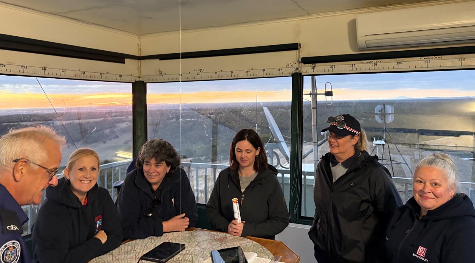 Women's Network members learn about fire tower operations from Michael Robertson