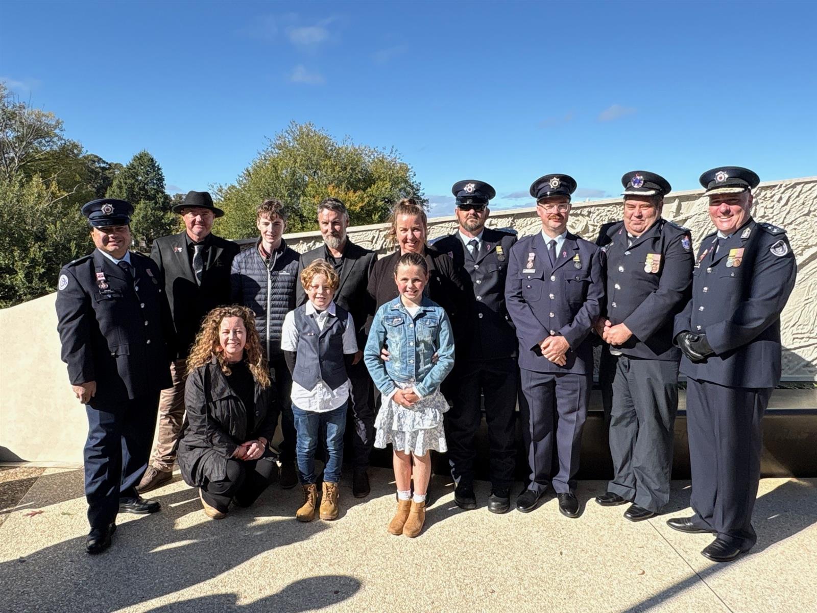 Garry Mallen's family with members of Portland brigade and Chief Officer Jason Heffernan