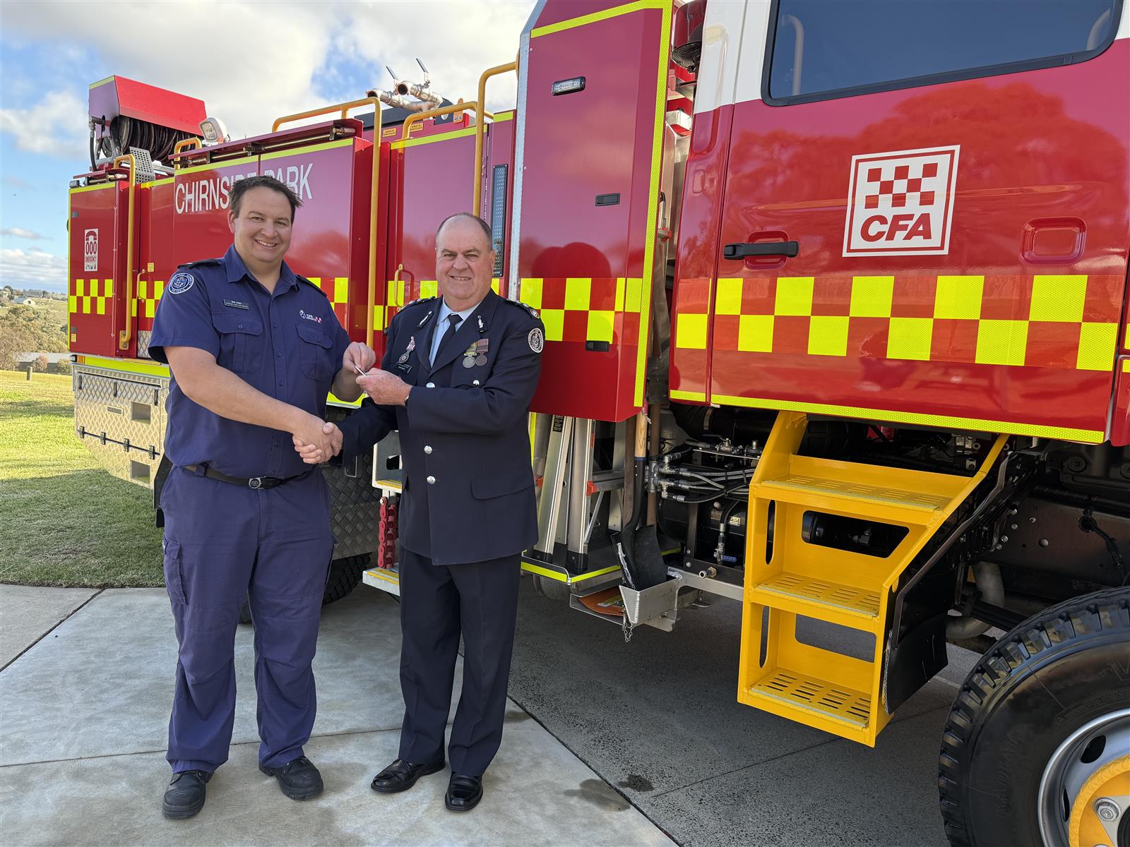 ACFO David Renkin handing the keys to Chirnside Park Captain Ben Cash