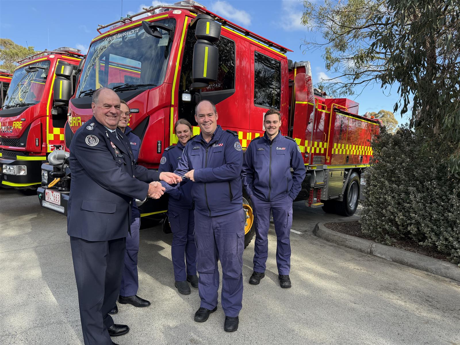 ACFO David Renkin handing the keys to South Warrandyte Captain Cameron MacKay