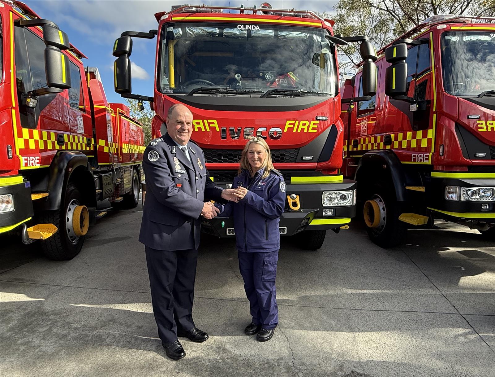ACFO David Renkin handing the keys to Olinda Captain Deb Weber