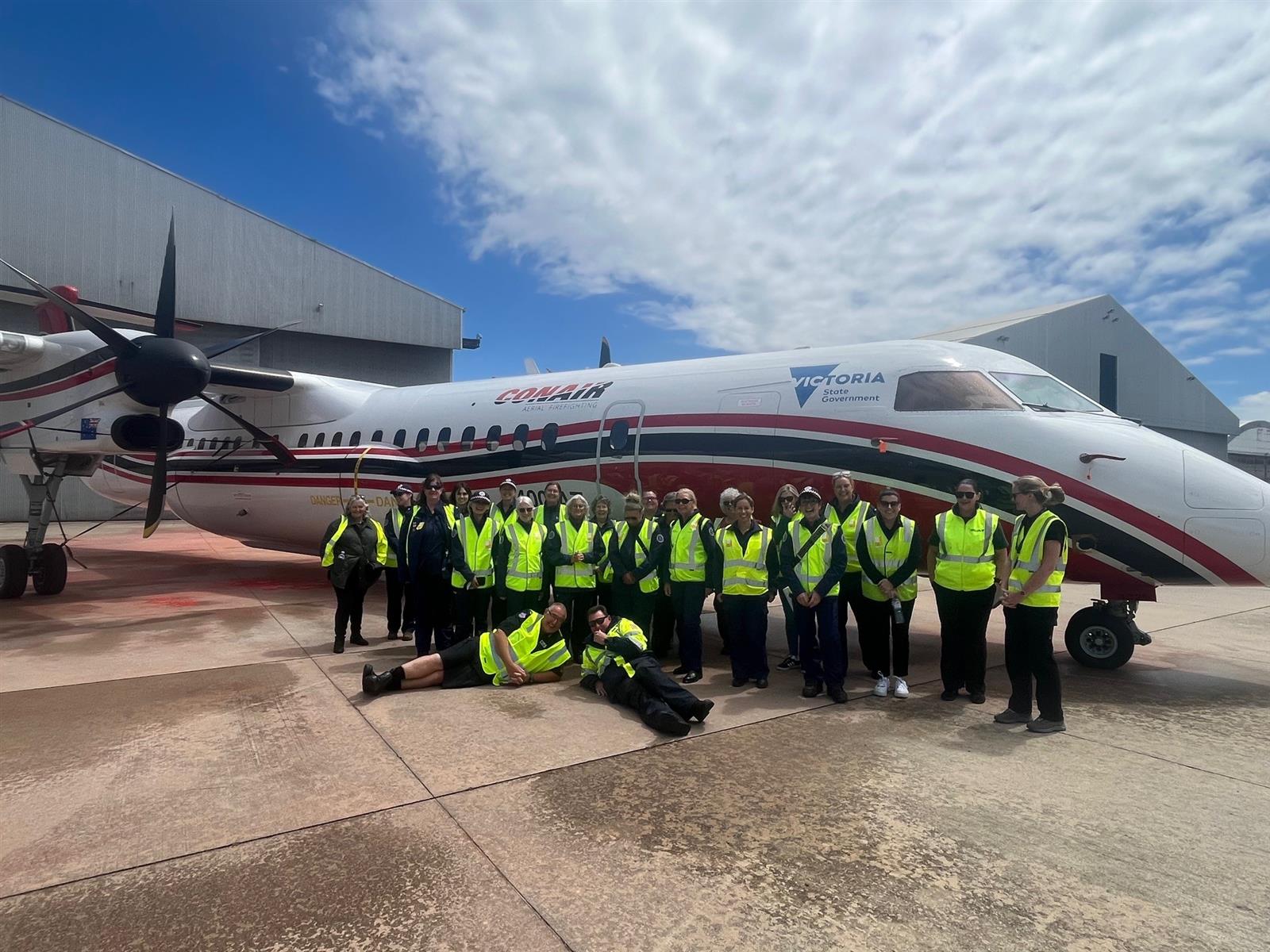 District 07 Women's Network members with Large Air Tanker
