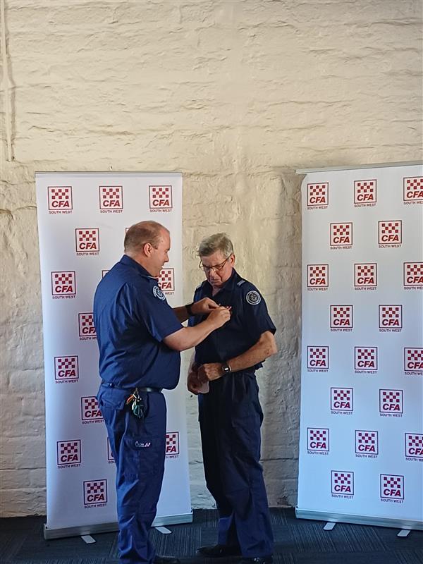 SWR DCO Adrian Gutsche presenting Chris Tully with CFA Life Membership