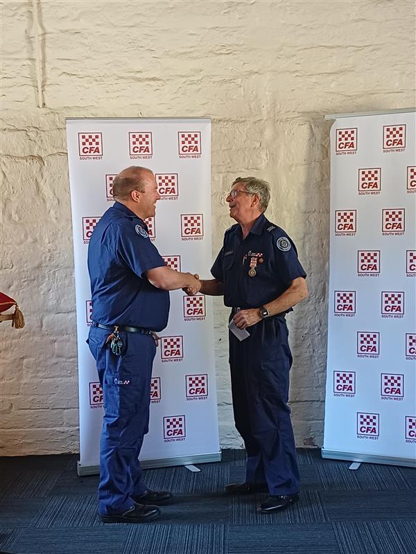 SWR DCO Adrian Gutsche presenting Chris Tully with CFA Life Membership