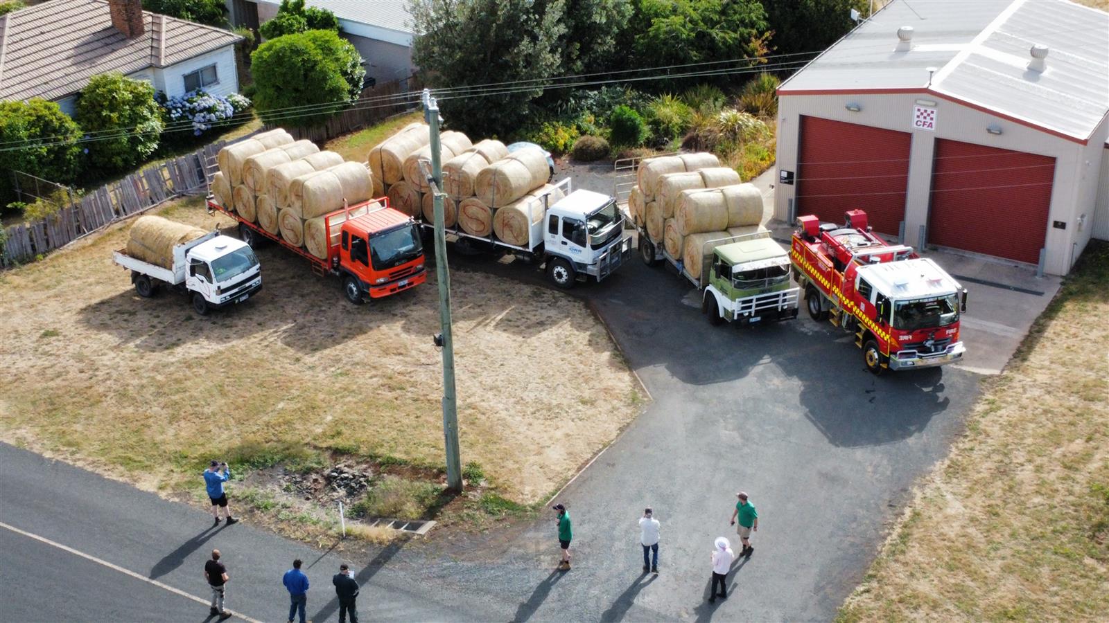 Hay being loaded for transport from Musk Fire Station