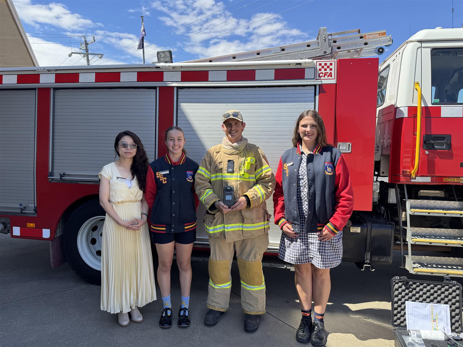 Stawell Firefighter Jai Smith demonstrating the gas detector to Stawell Secondary College's school captain
