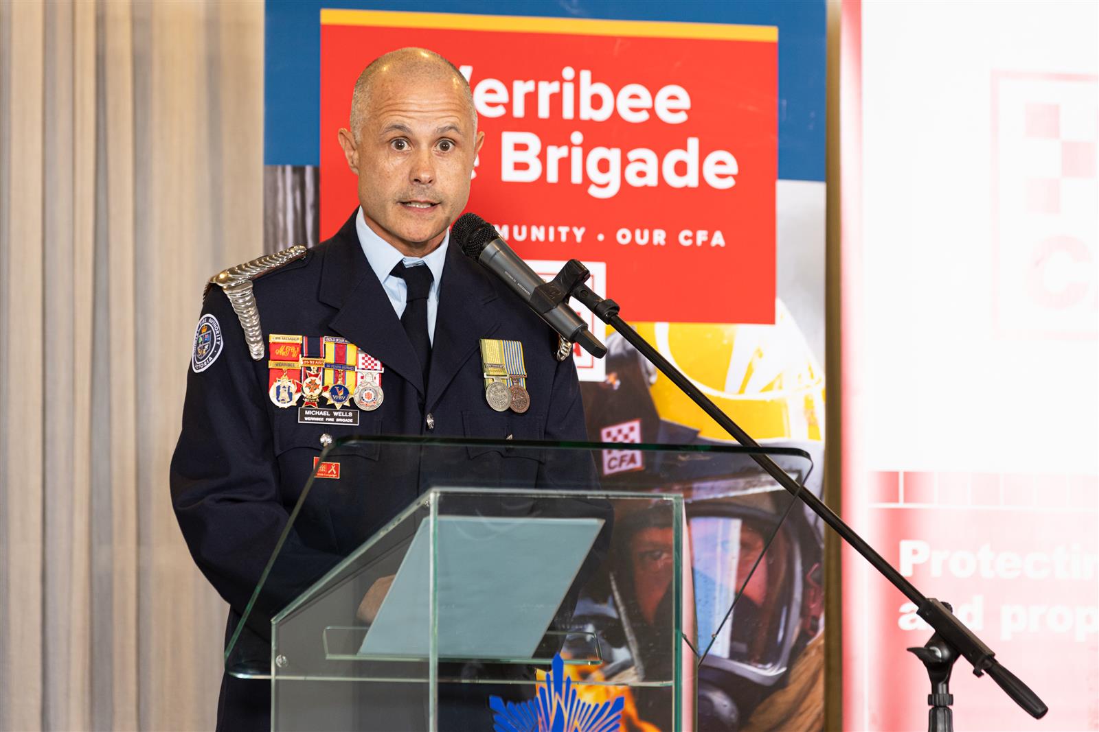 Captain Michael Wells addresses the crowd