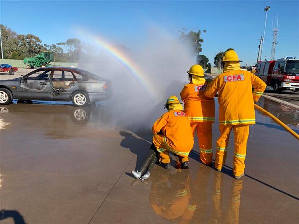 Image of a group of people putting out fire